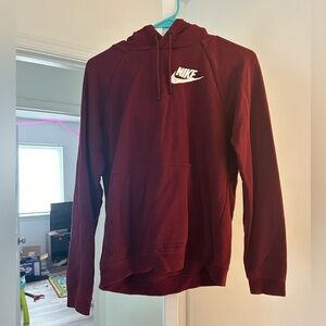 Maroon Nike hoodie, slim fit.